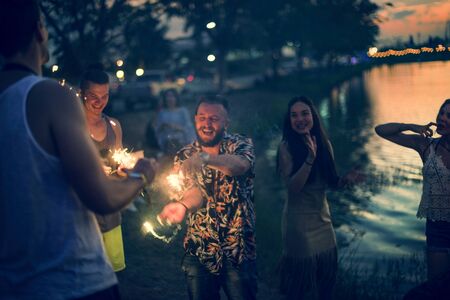 People Enjoying Sparkler in Festival Event
