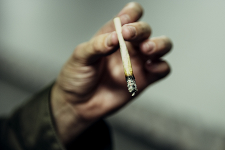 Homeless Man Hand Holding Cigarette
