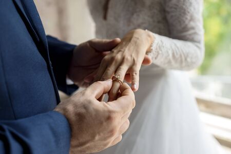 Groom Put on Wedding Ring Bride Hand