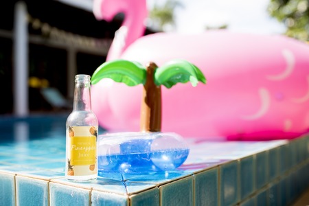Closeup of pineapple juice bottle with inflatable