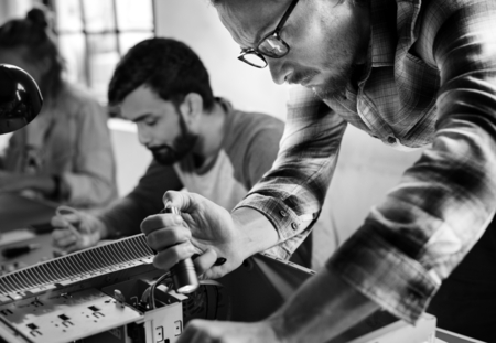 Foto de Technicians working on computer electronics parts - Imagen libre de derechos