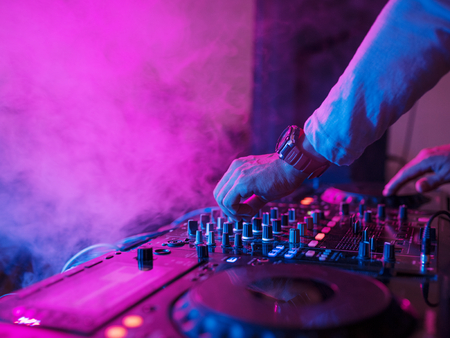 Hand on a sound mixer station