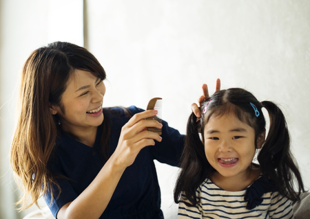 Mother and daughter playing together
