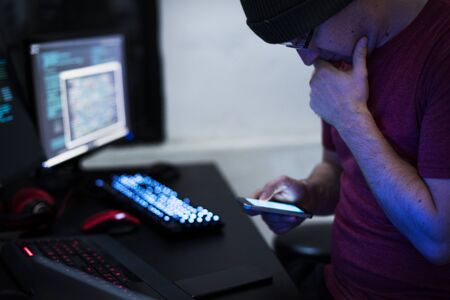 Hacker hacking a coding cyberspace information