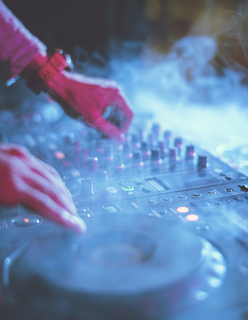 Hand on a sound mixer station