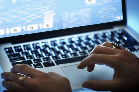 Hands typing on notebook keyboard