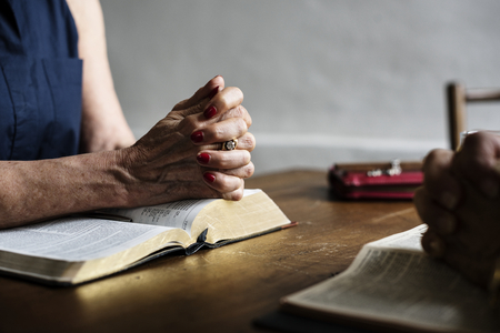 Christianity people praying reading bible