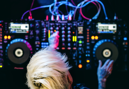 DJ is on a mixer station