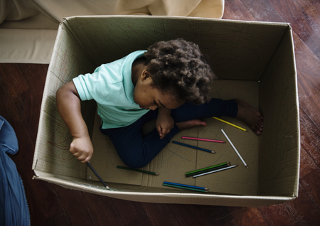 Black kid enjoying his painting