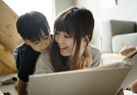 Mother and son playing together with happiness
