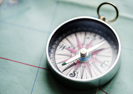 Closeup of compass on the map