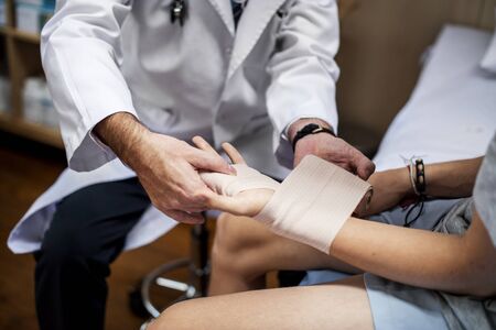 Doctor assisting a patient
