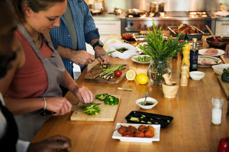 Group of friends are cooking in the kitchen