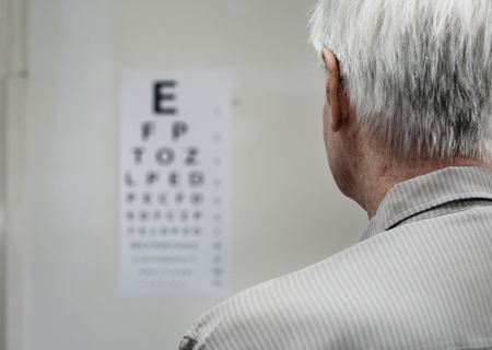 An elderly patient is having sight testing