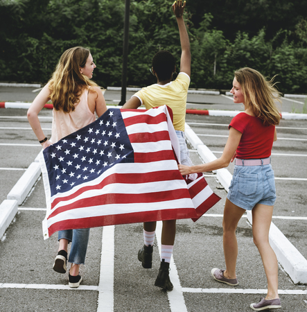 Rear view of diverse women group with American flag