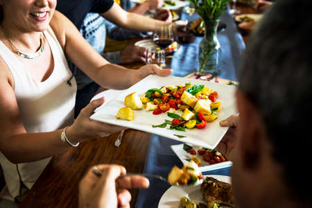 Group of diverse friends are having a dinner together