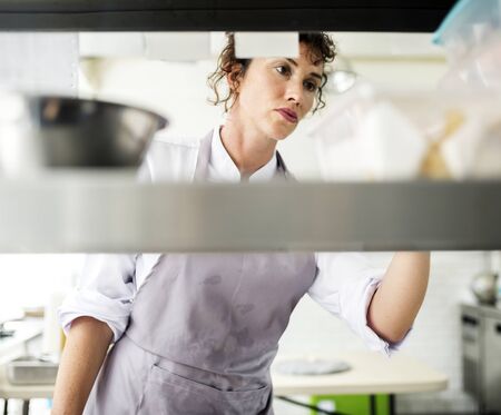 Closeup of kitchen staff prepare cooking ingredients