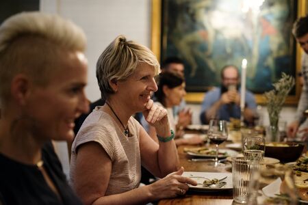 Group of diverse friends are having a dinner together