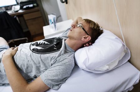 Young man in a hospital bed