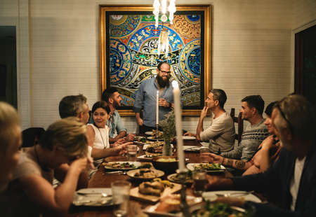 Group of diverse friends are having a dinner together