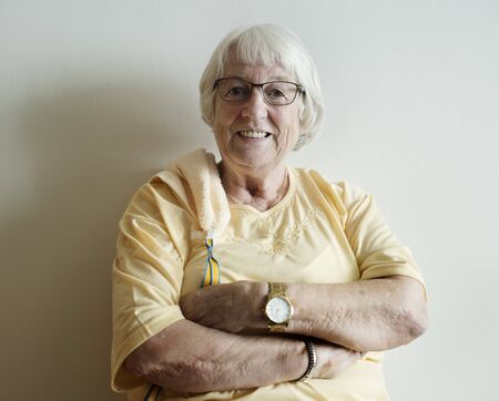 Senior woman arms crossed and smiling