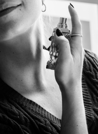 Woman using a perfume