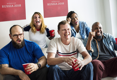 Friends cheering their team
