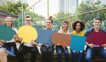 Friends holding up empty placard copyspace thought bubbles