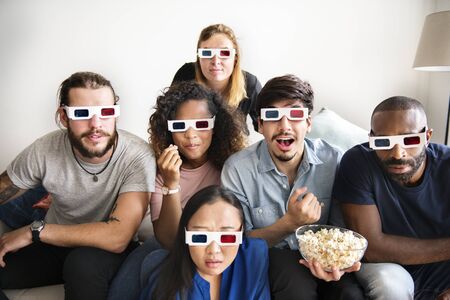 Group of diverse friends watching 3D movie together