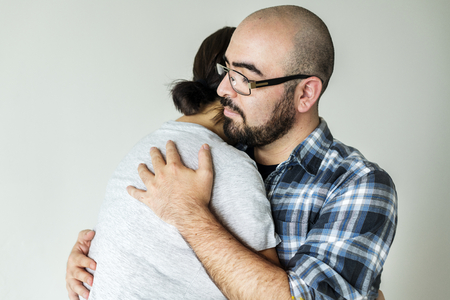 Man hugging woman