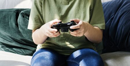 Woman playing video game alone