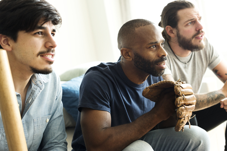 Friends cheering sport league together