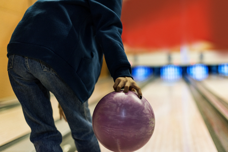 Grabbing the pink bowling ball