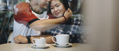 Lovely asian couple having coffee