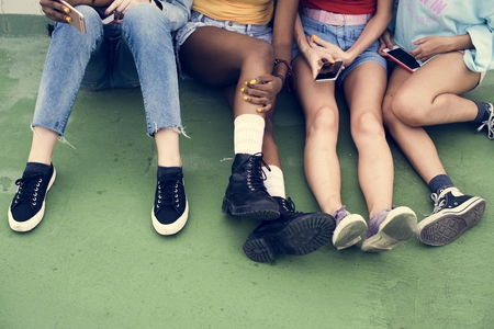 Group of diverse women with mobile phone