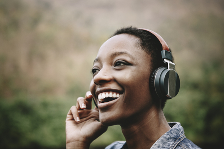 Photo for Woman listening to music in nature - Royalty Free Image