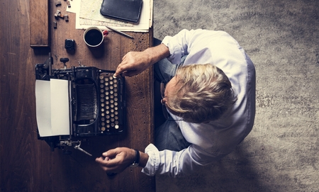 Hands with retro vintage typewriter