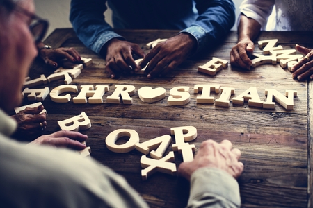 A wooden alphabet christian word on the table