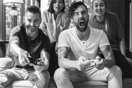 Friends enjoying video game together