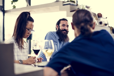 People having wine and talking with friends