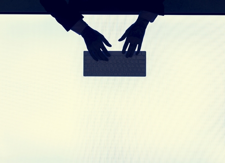 Hands typing on a keyboard