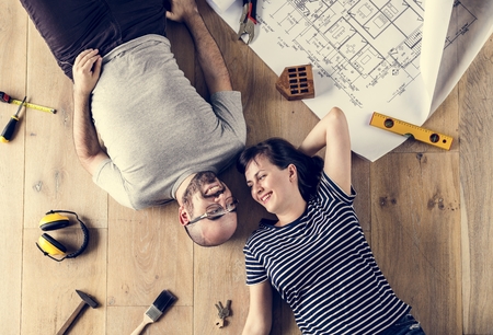 Family lying on wooden floor