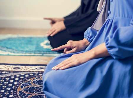 Muslim prayers in Tashahhud posture