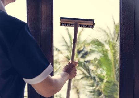 Housekeeper cleaning a hotel room