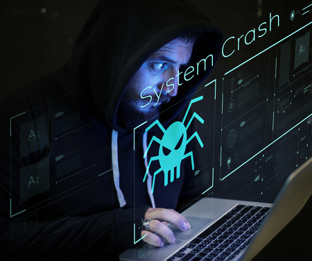 Programmer working on a laptop in the late night