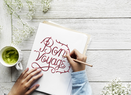 An artist creating hand lettering artwork from motivation quote