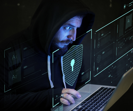Programmer working on a laptop in the late night