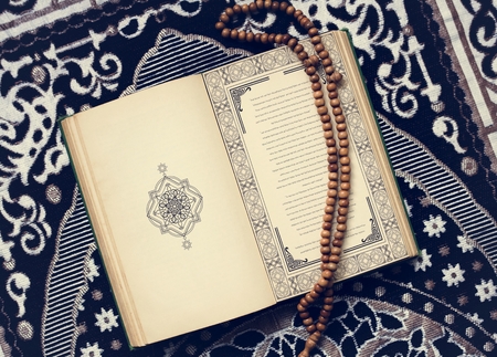 Holy book of muslims and prayer beads