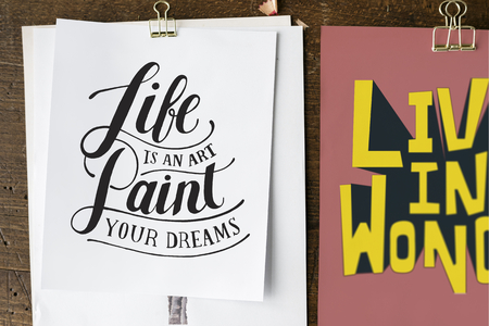 Foto de Hand lettering of motivation quote on sketch sheets - Imagen libre de derechos