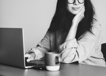 Woman working on a laptop in her home